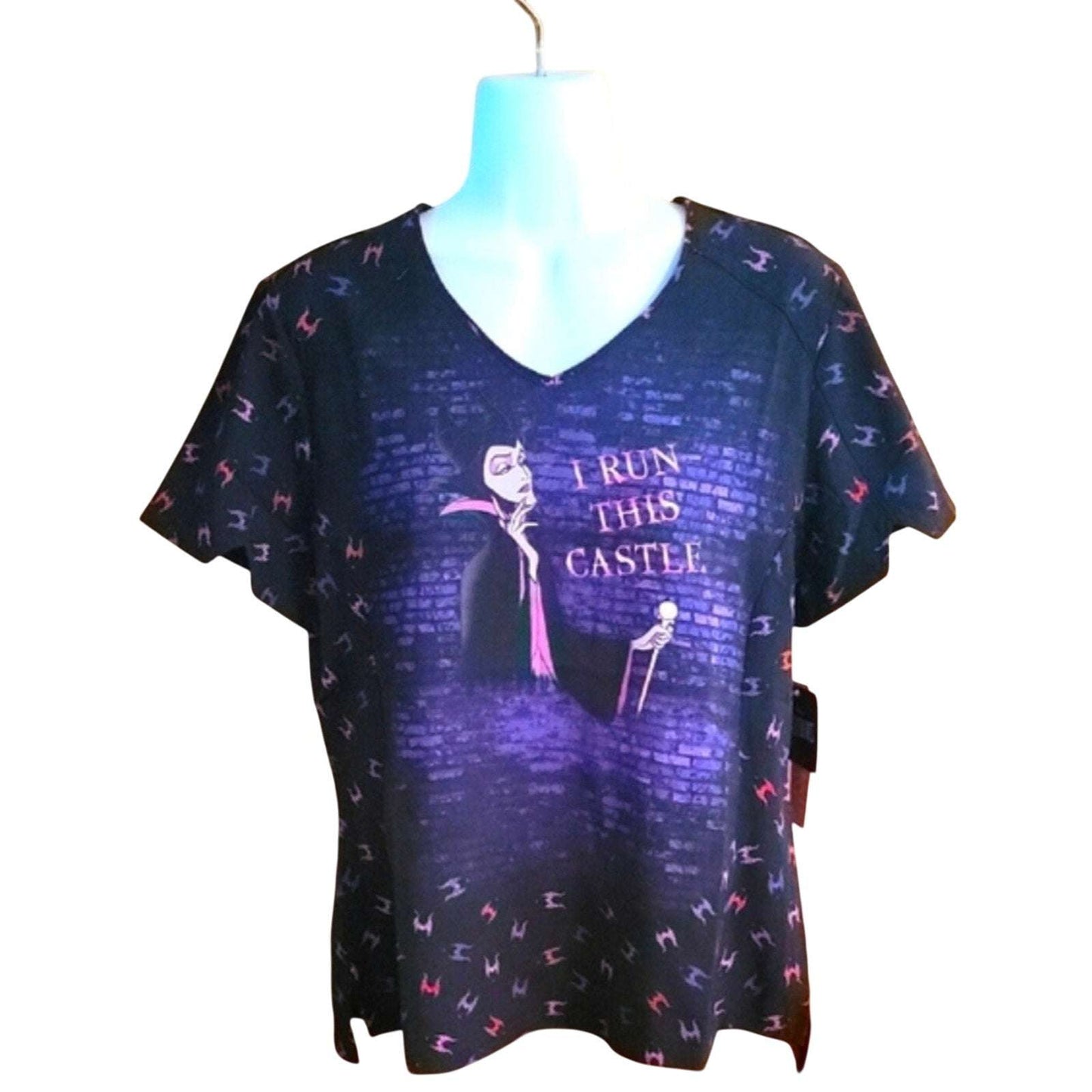 Disney Villains Maleficent V-neck scrub top with "I Run This Castle" graphic and villain pattern