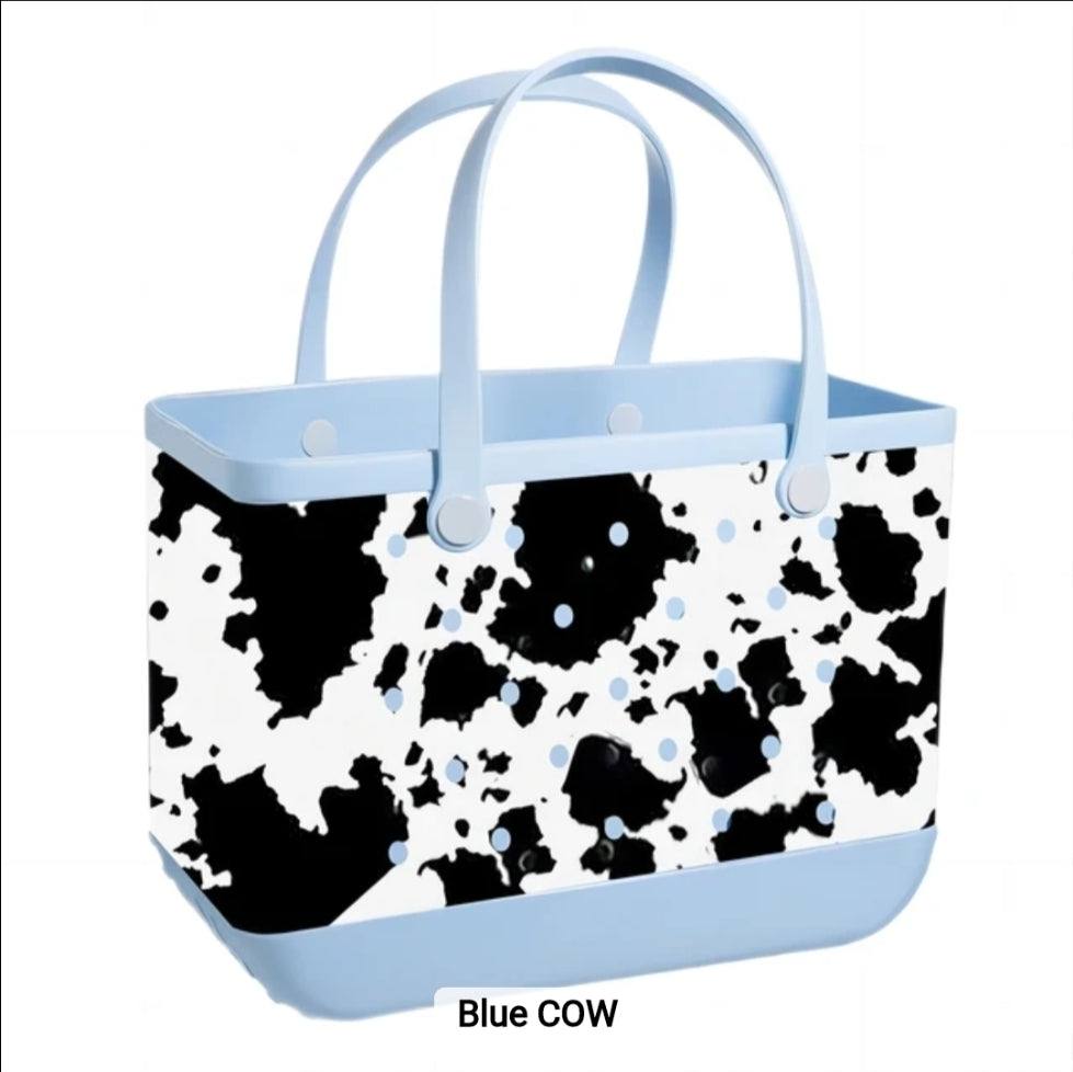 Blue Cow patterned tote bag with light blue handles and base