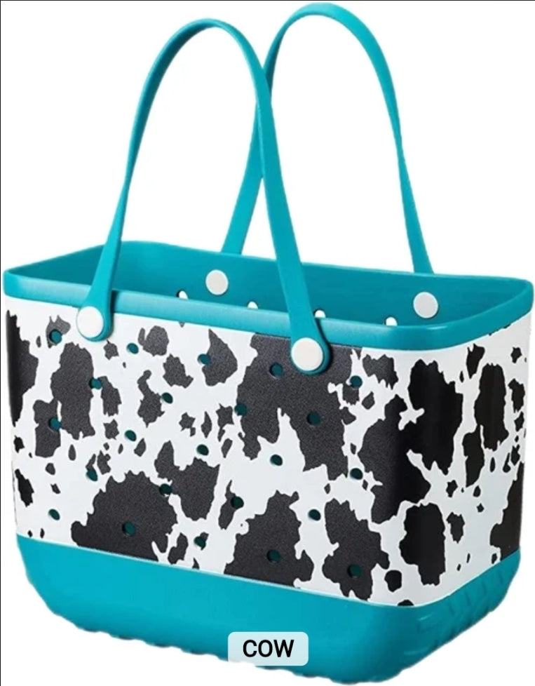 Blue and white cow print tote bag with dual handles