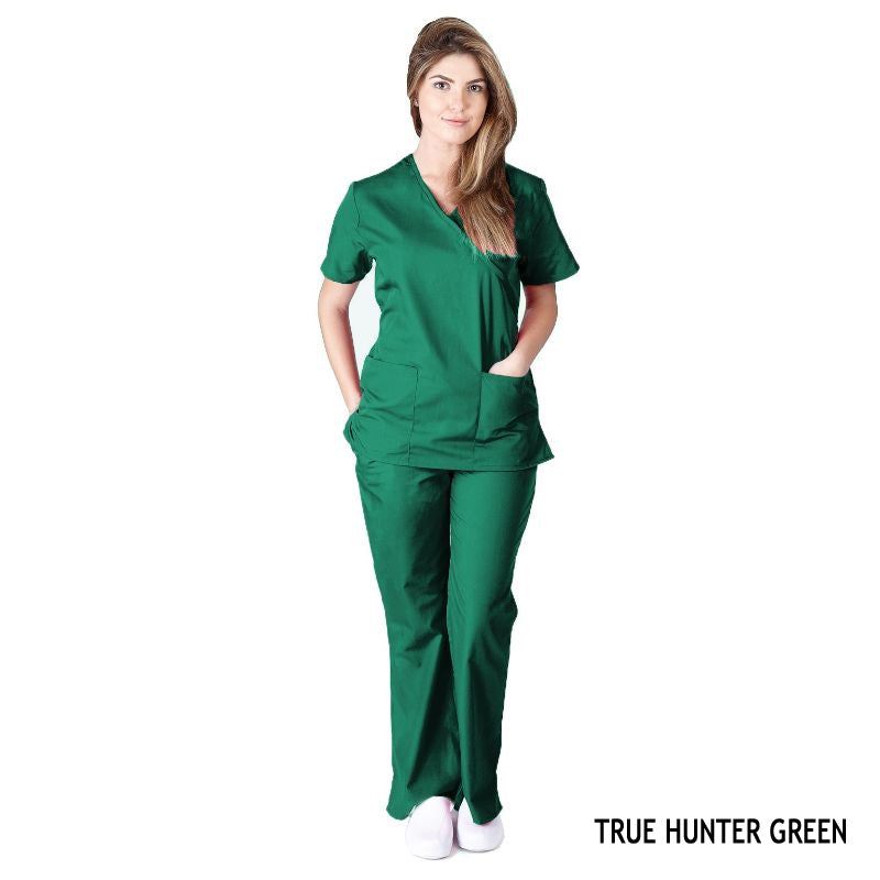 Female healthcare professional wearing hunter green Mock Wrap Scrub Set. Image shows two front pockets on the scrub top, highlighting the set's functionality and comfort in a medical setting.