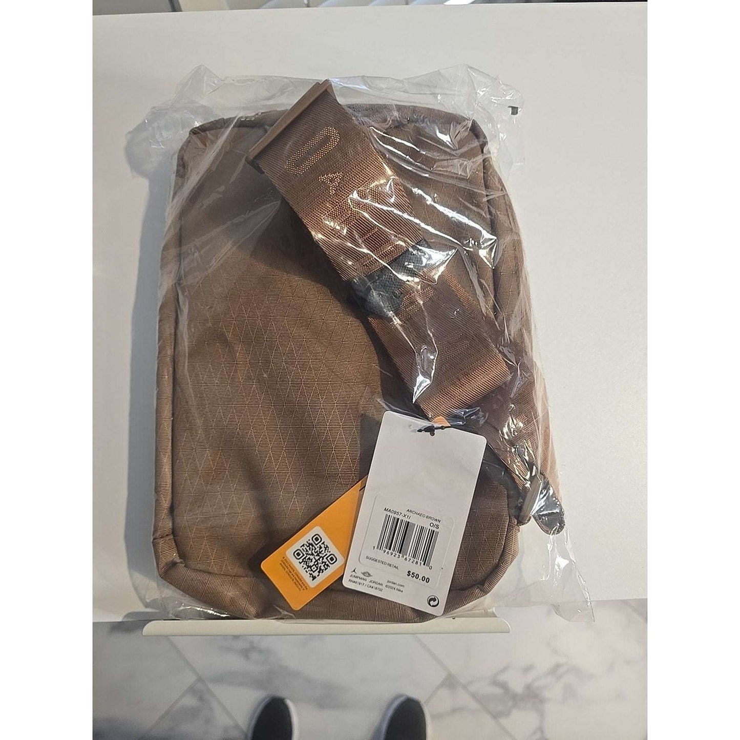 Jordan Crossbody Sling Bag in Archaeo Brown with Jump Man logo, adjustable strap, and zip closure for men and women