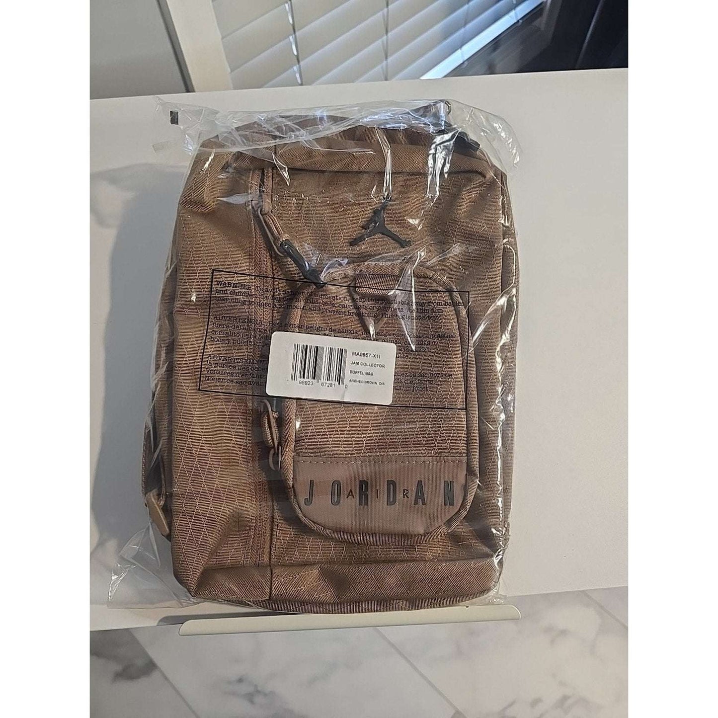 Jordan Crossbody Sling Bag in Archaeo Brown with Jump Man logo and adjustable strap